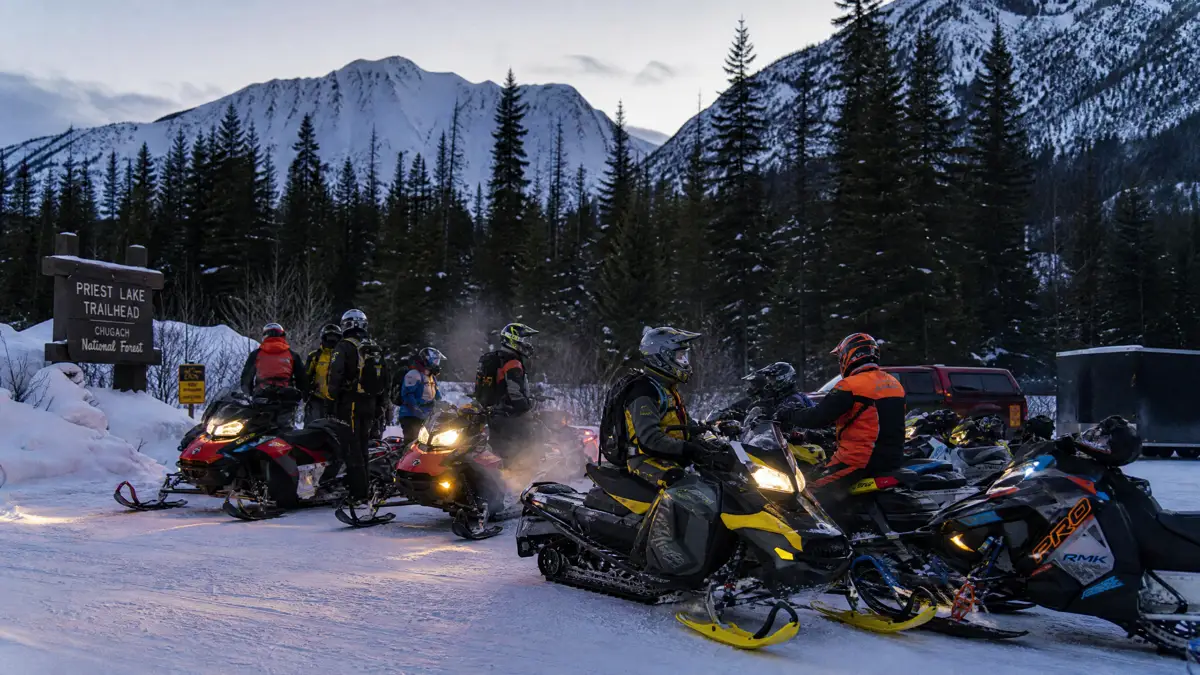 Snowmobiles staged and ready before a club ride